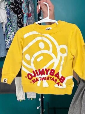 Bape Kids Yellow Sweatshirt with White Ape Graphic and Red Logo